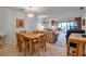 A spacious living room adjacent to the dining area and porch at 3500 El Conquistador Pkwy # 128, Bradenton, FL 34210