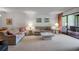 Comfortable living room with access to the outdoor porch at 3500 El Conquistador Pkwy # 128, Bradenton, FL 34210