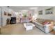 A spacious living room adjacent to the dining area and kitchen at 3500 El Conquistador Pkwy # 128, Bradenton, FL 34210