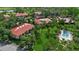 Community pool with lawn and mature landscaping at this townhome complex in a golf course community at 3500 El Conquistador Pkwy # 128, Bradenton, FL 34210