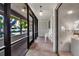 Relaxing screened porch with neutral tile floors and plenty of natural light at 3500 El Conquistador Pkwy # 128, Bradenton, FL 34210