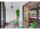 Relaxing balcony features comfortable seating, a hanging plant, and views of the community at 3500 El Conquistador Pkwy # 132, Bradenton, FL 34210