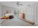 Bedroom with carpet, ceiling fan, and sliding door to patio at 3500 El Conquistador Pkwy # 132, Bradenton, FL 34210