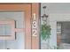 Exterior door with address '132' and view to the patio at 3500 El Conquistador Pkwy # 132, Bradenton, FL 34210
