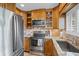 Cozy kitchen featuring stainless steel appliances and granite countertops at 3500 El Conquistador Pkwy # 132, Bradenton, FL 34210