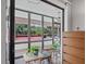 Covered patio with views of mature trees and red roof tile buildings at 3500 El Conquistador Pkwy # 132, Bradenton, FL 34210