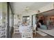 Enclosed sunroom features white accents and a dining set at 3500 El Conquistador Pkwy # 132, Bradenton, FL 34210
