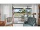 Bright sunroom with seating area and golf course views at 3500 El Conquistador Pkwy # 132, Bradenton, FL 34210