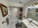 Bathroom features a tub with a shower and a vanity with a mirror at 3752 Collins St # 508, Sarasota, FL 34232