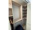 Walk-in closet with custom shelving and hanging space at 3752 Collins St # 508, Sarasota, FL 34232