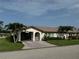 Charming single-story home with tropical landscaping, covered carport, and well-maintained lawn at 3752 Collins St # 508, Sarasota, FL 34232