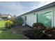 Exterior view of home with back patio, lush foliage, and mature landscaping at 3752 Collins St # 508, Sarasota, FL 34232