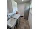 Laundry room with modern gray cabinets, gray countertops, and a sink at 3752 Collins St # 508, Sarasota, FL 34232