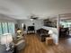 Spacious living room with hardwood floors and views into the dining room at 3752 Collins St # 508, Sarasota, FL 34232