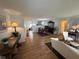Spacious open-concept living area with hardwood floors, elegant furnishings and plentiful light at 3752 Collins St # 508, Sarasota, FL 34232