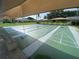 Recreation area features shuffleboard courts with shaded benches, perfect for community enjoyment at 3752 Collins St # 508, Sarasota, FL 34232