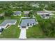 Aerial view of property showcasing landscaping, fenced backyard, and neighborhood at 3865 Everglades Ter, North Port, FL 34286