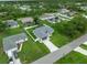 Aerial view of property showcasing yard, landscaping, and neighborhood at 3865 Everglades Ter, North Port, FL 34286