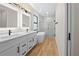 Bathroom features double vanity, modern fixtures, soaking tub, and glass enclosed shower at 3865 Everglades Ter, North Port, FL 34286