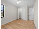 Bedroom with wood-look tile floors, closet with folding doors, and a ceiling fan at 3865 Everglades Ter, North Port, FL 34286