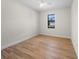 Bedroom features wood-look tile, a ceiling fan, and a window with a view at 3865 Everglades Ter, North Port, FL 34286