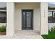 Close up of front door with a modern design at 3865 Everglades Ter, North Port, FL 34286