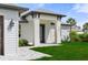 Inviting entrance showcasing the front door and the well-manicured lawn at 3865 Everglades Ter, North Port, FL 34286