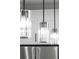 Modern kitchen light fixtures over stainless steel appliances brighten up the kitchen at 3865 Everglades Ter, North Port, FL 34286