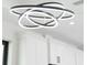 A stylish modern light fixture accents the home's bright, white kitchen at 3865 Everglades Ter, North Port, FL 34286