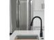 Close-up of a kitchen featuring a black faucet, stainless steel refrigerator, and a bright countertop at 3865 Everglades Ter, North Port, FL 34286