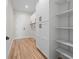 Spacious mud room with ample storage cabinets and shelving at 3865 Everglades Ter, North Port, FL 34286