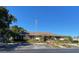 A well-maintained clubhouse with parking and landscaping, showcasing community amenities at 390 301 W Blvd # 2C, Bradenton, FL 34205