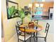 Cozy dining area featuring a round table, stylish chairs, and a chandelier for warm lighting at 390 301 W Blvd # 2C, Bradenton, FL 34205