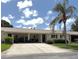 Charming single-story villa with attached carport and well-maintained landscaping at 390 301 W Blvd # 2C, Bradenton, FL 34205