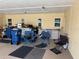 A spacious garage with lots of space for parking and storage with blue camping chairs in the foreground at 390 301 W Blvd # 2C, Bradenton, FL 34205