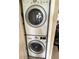 Efficient laundry area with stacked washer and dryer units for space-saving convenience at 390 301 W Blvd # 2C, Bradenton, FL 34205