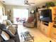 Inviting living room with sliding glass doors to the porch and comfortable seating arrangement at 390 301 W Blvd # 2C, Bradenton, FL 34205