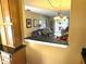 Open-concept living room with a chandelier and sliding glass doors for natural light at 390 301 W Blvd # 2C, Bradenton, FL 34205