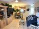 Bright living room featuring tile flooring and comfortable seating arrangement with a view of the dining room at 390 301 W Blvd # 2C, Bradenton, FL 34205