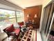 Relaxing sunroom featuring comfortable seating, large windows, and decorative accents at 390 301 W Blvd # 2C, Bradenton, FL 34205