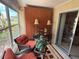 Relaxing sunroom featuring comfortable seating, decor, and serene views at 390 301 W Blvd # 2C, Bradenton, FL 34205