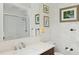 Well-lit bathroom with a modern sink and fixtures, and a walk-in shower with glass doors at 4224 Boca Pointe Dr, Sarasota, FL 34238