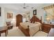 This bedroom has a queen-size bed, furnishings, and lots of natural light from the windows at 4224 Boca Pointe Dr, Sarasota, FL 34238