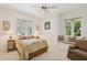 Relaxing bedroom with comfortable furnishings, soft colors, and plenty of natural light at 4224 Boca Pointe Dr, Sarasota, FL 34238