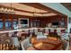 Upscale clubhouse bar area with ample seating and fully stocked shelves at 4224 Boca Pointe Dr, Sarasota, FL 34238