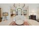 Elegant foyer featuring high ceilings, archway, and seamless access to living spaces at 4224 Boca Pointe Dr, Sarasota, FL 34238
