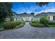 Beautiful home exterior with a landscaped front yard and a paved driveway leading to the entrance at 4224 Boca Pointe Dr, Sarasota, FL 34238