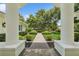 Manicured front lawn featuring a symmetrical walkway and lush landscaping at 4224 Boca Pointe Dr, Sarasota, FL 34238