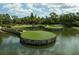 Scenic aerial shot of a golf course with island greens surrounded by water at 4224 Boca Pointe Dr, Sarasota, FL 34238