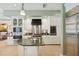 Modern kitchen with stainless steel appliances, granite countertops, and custom white cabinetry at 4224 Boca Pointe Dr, Sarasota, FL 34238